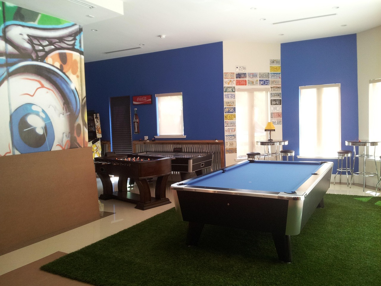 Recreation room with pool table, foosball, and arcade games